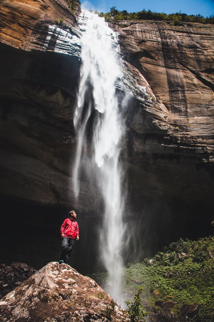 Explore a serene waterfall with an adventurous spirit in Urubici, Brazil.